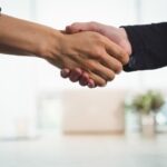 business-executives-shaking-hands-with-each-other_107420-63888.jpg